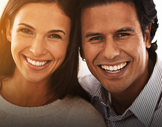 Close Up of Mom and Dad Smiling after Teeth Cleaning at the Family Dentist - The Super Dentists