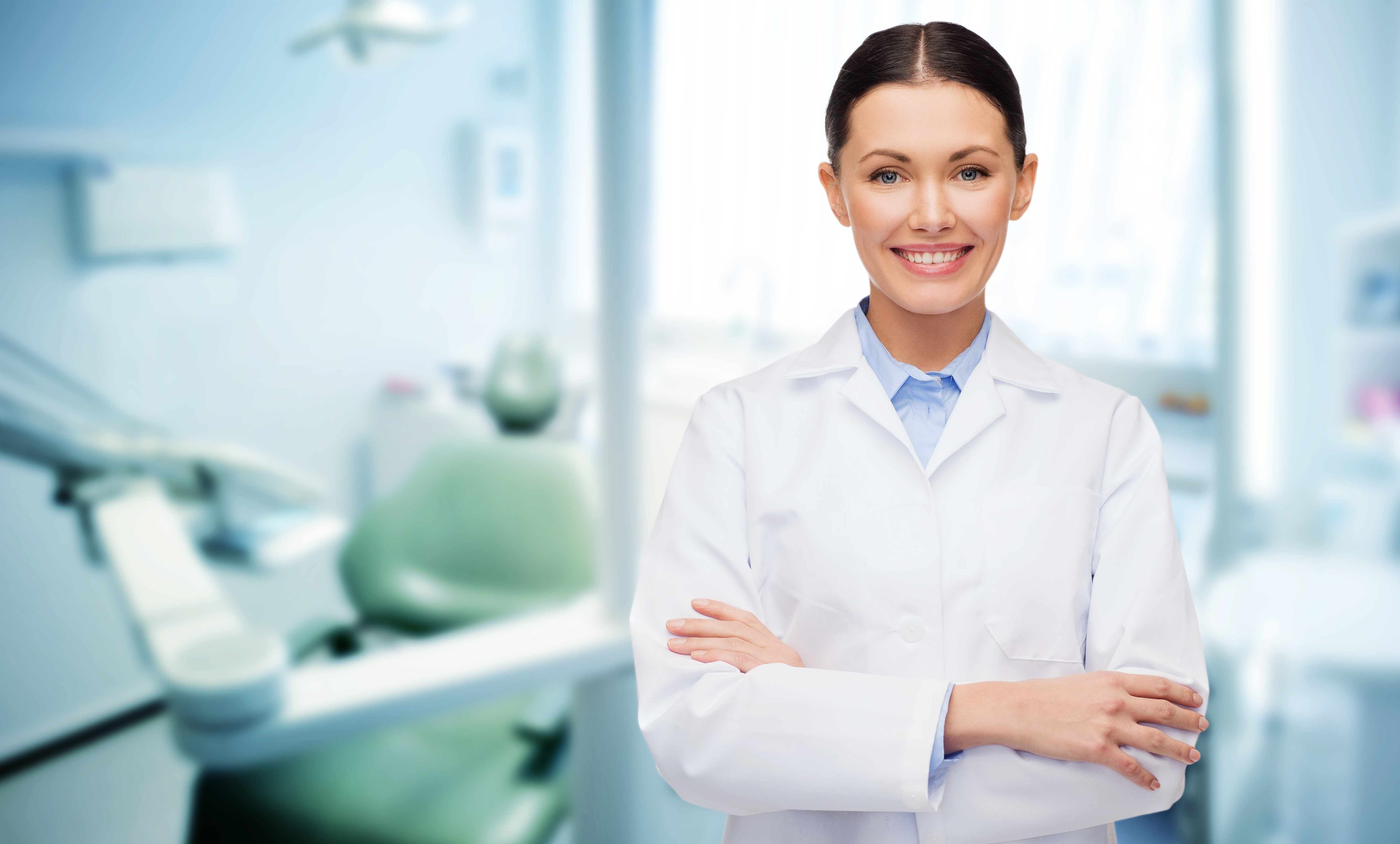 Pediatric Tongue Tie Dentist Standing with Arms Crossed in Lab Coat at The Super Dentists