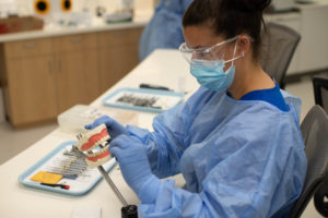 woman learning with the super dentists