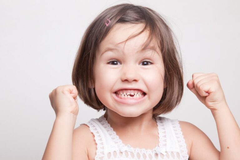 Excited child who lost first tooth