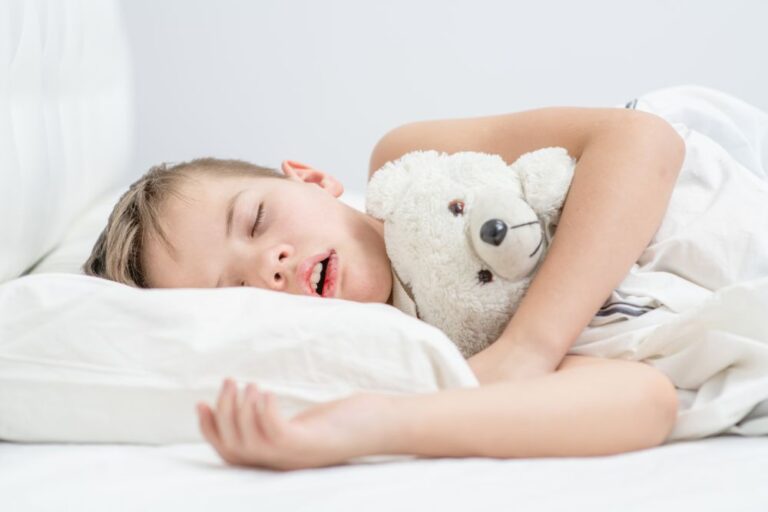 Young boy sleeping with his mouth open