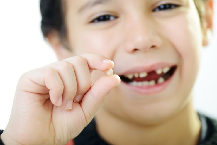 Young boy who lost his first tooth