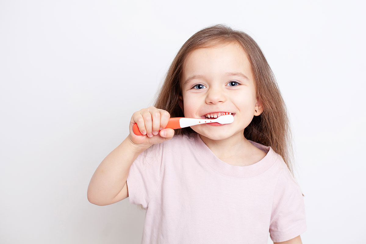 Little girl brushing teeth