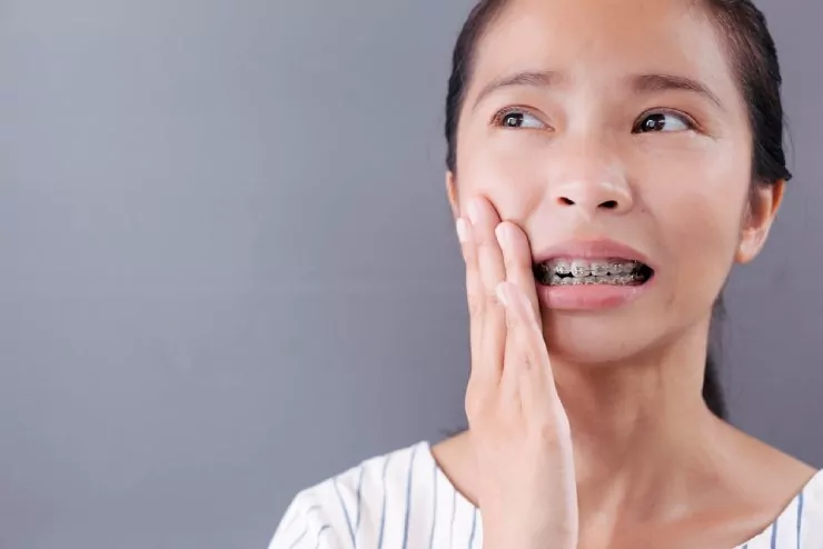 Girl dealing with painful braces