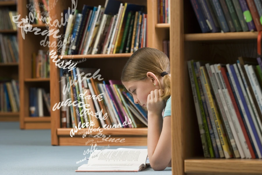Young girl reads a book at a San Diego area public library