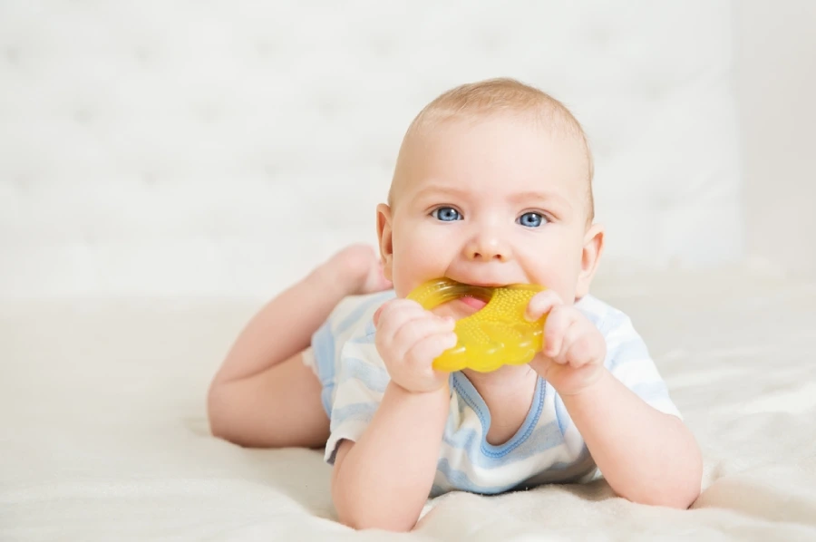 Baby chewing a teething toy