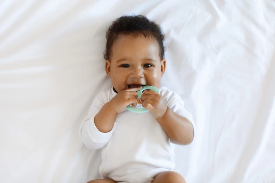 Baby biting a teething toy