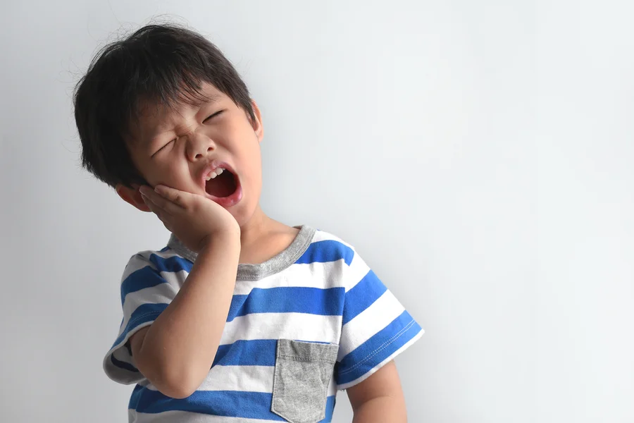 Young toddler experiences sensitive teeth