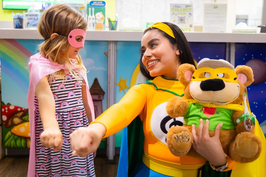 Melo-D playing superhero with a child