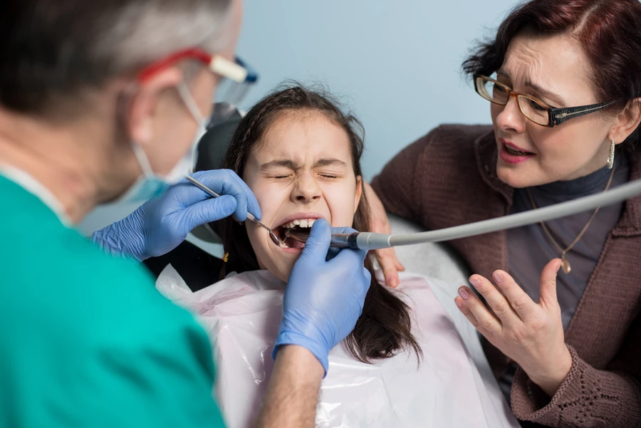 Young girl experiences a dental emergency