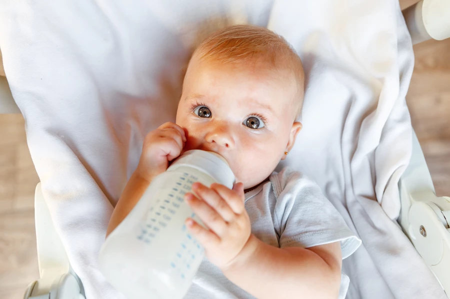 Baby sleeps with bottle, a habit linked with baby bottle tooth decay