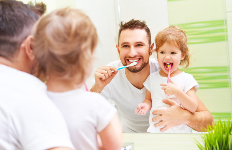 Father Daughter Brushing Teeth